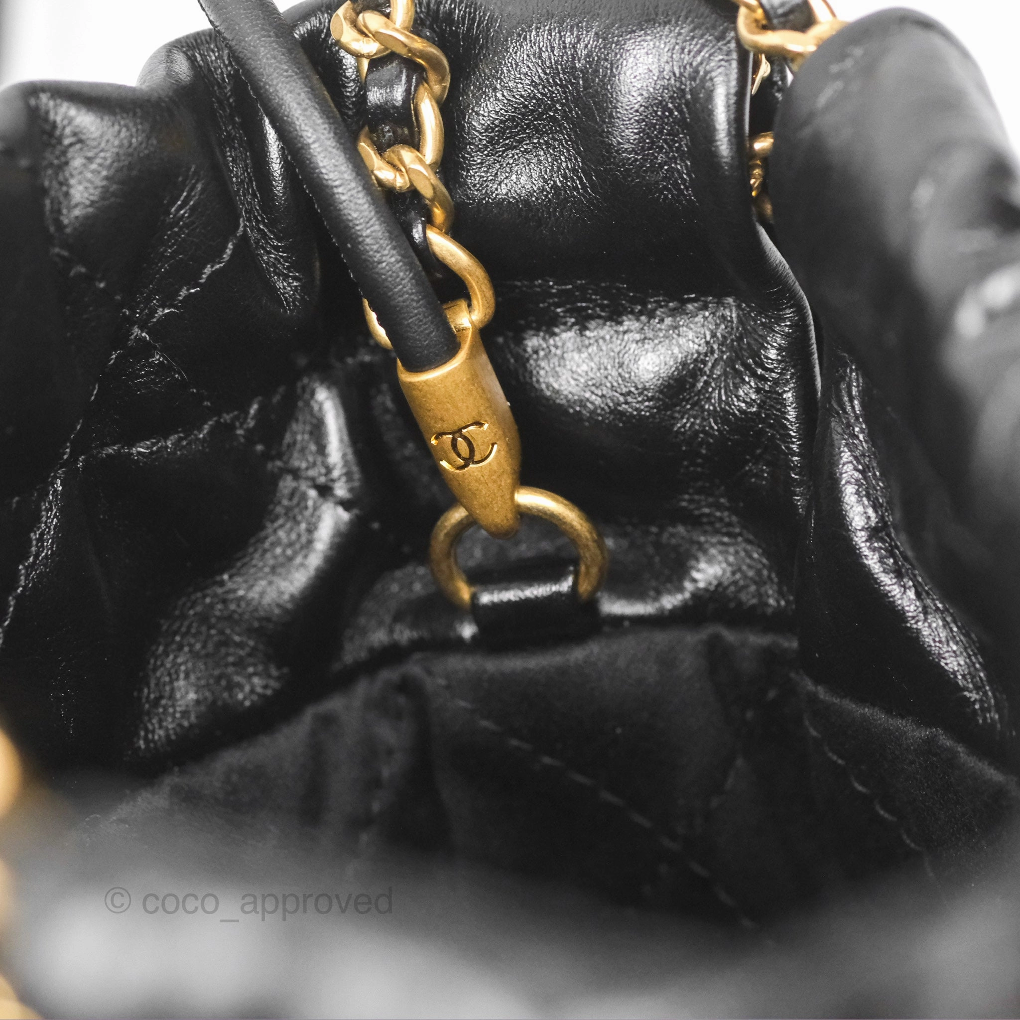 Chanel 22 Mini Bag Black Crumpled Calfskin White Lacquered Metal Logo