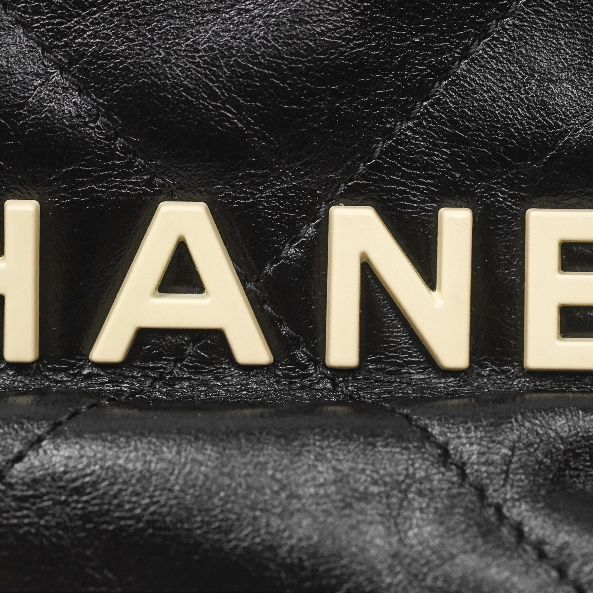 Chanel 22 Mini Bag Black Crumpled Calfskin White Lacquered Metal Logo